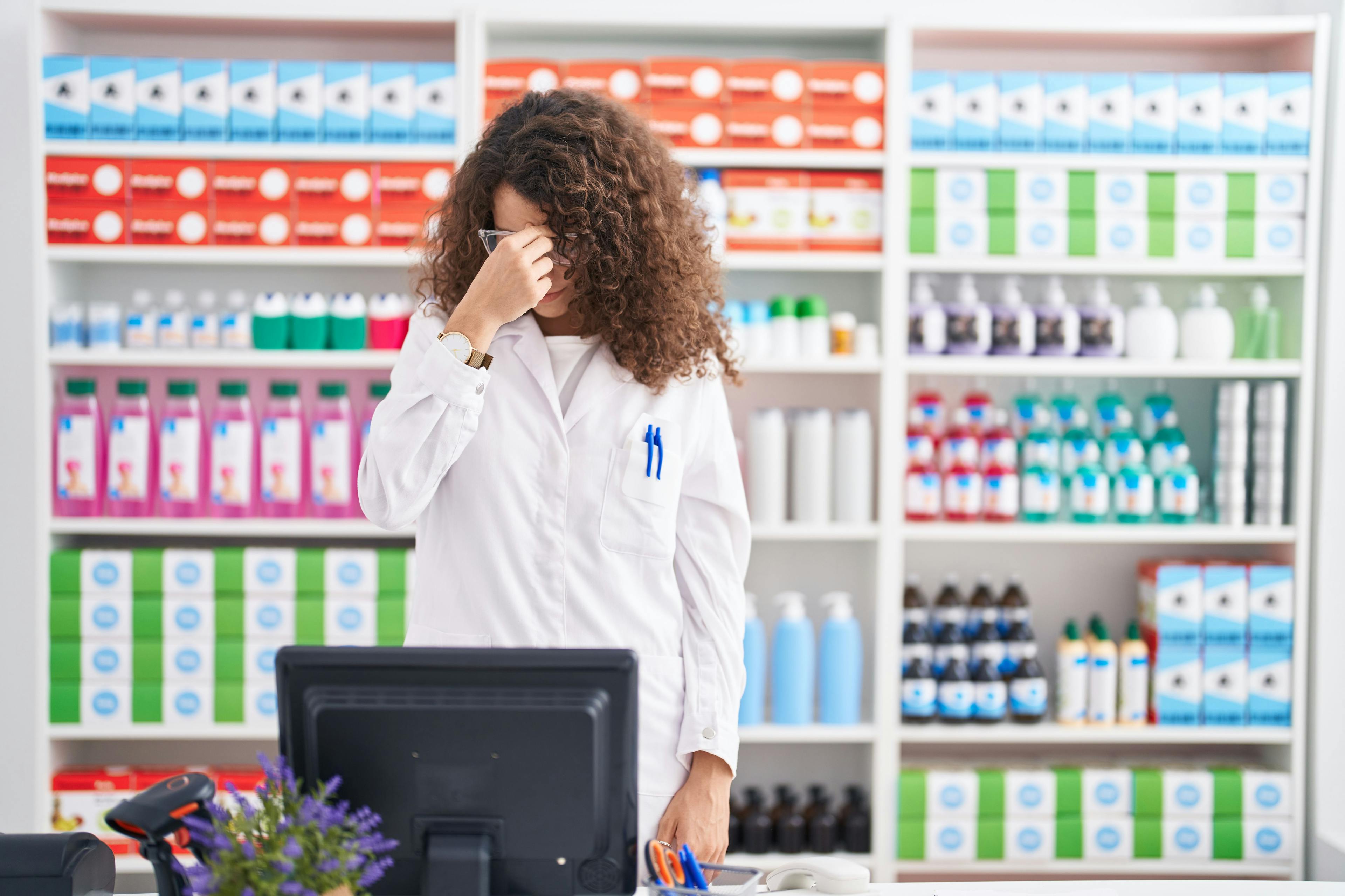 Pharmacist feeling overwhelmed -- Image credit: Krakenimages.com | stock.adobe.com