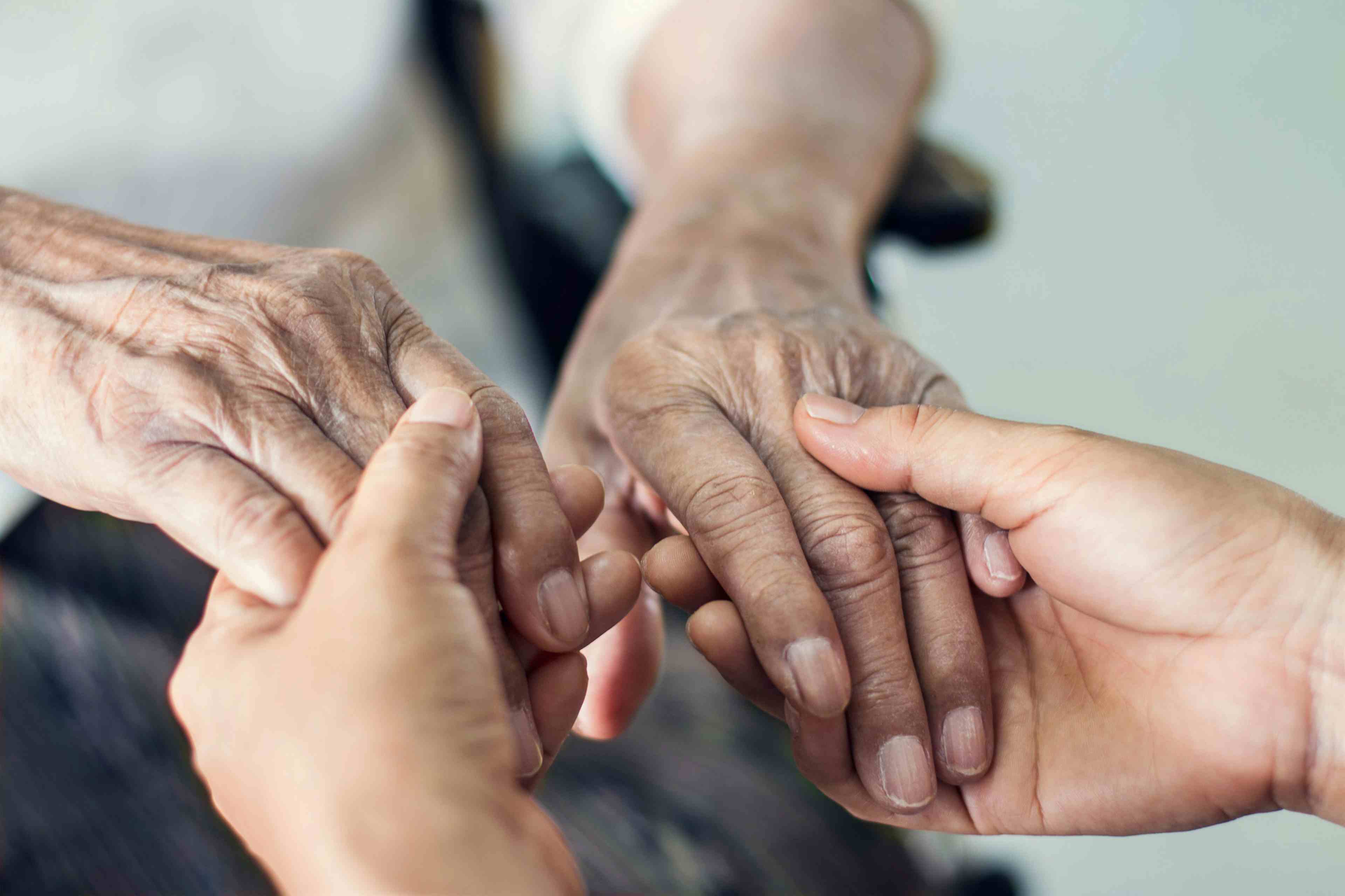 Close up hands of helping hands elderly home care. Mother and daughter. Mental health and elderly care concept - Image credit:  ipopba | stock.adobe.com 