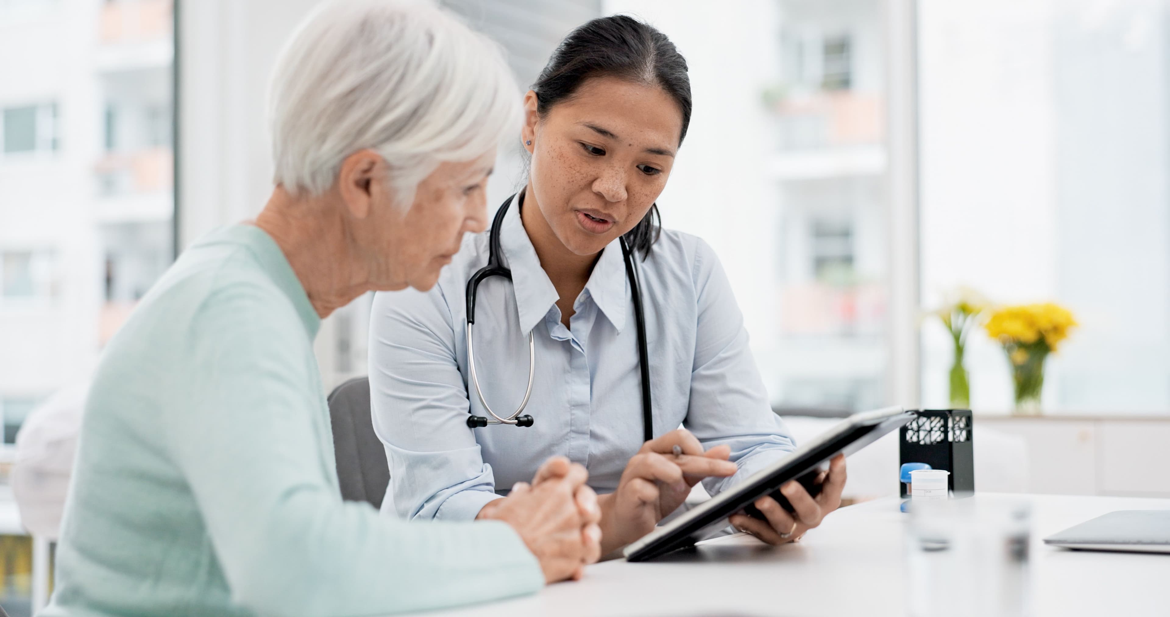 Pharmacist talking to a patient with cancer