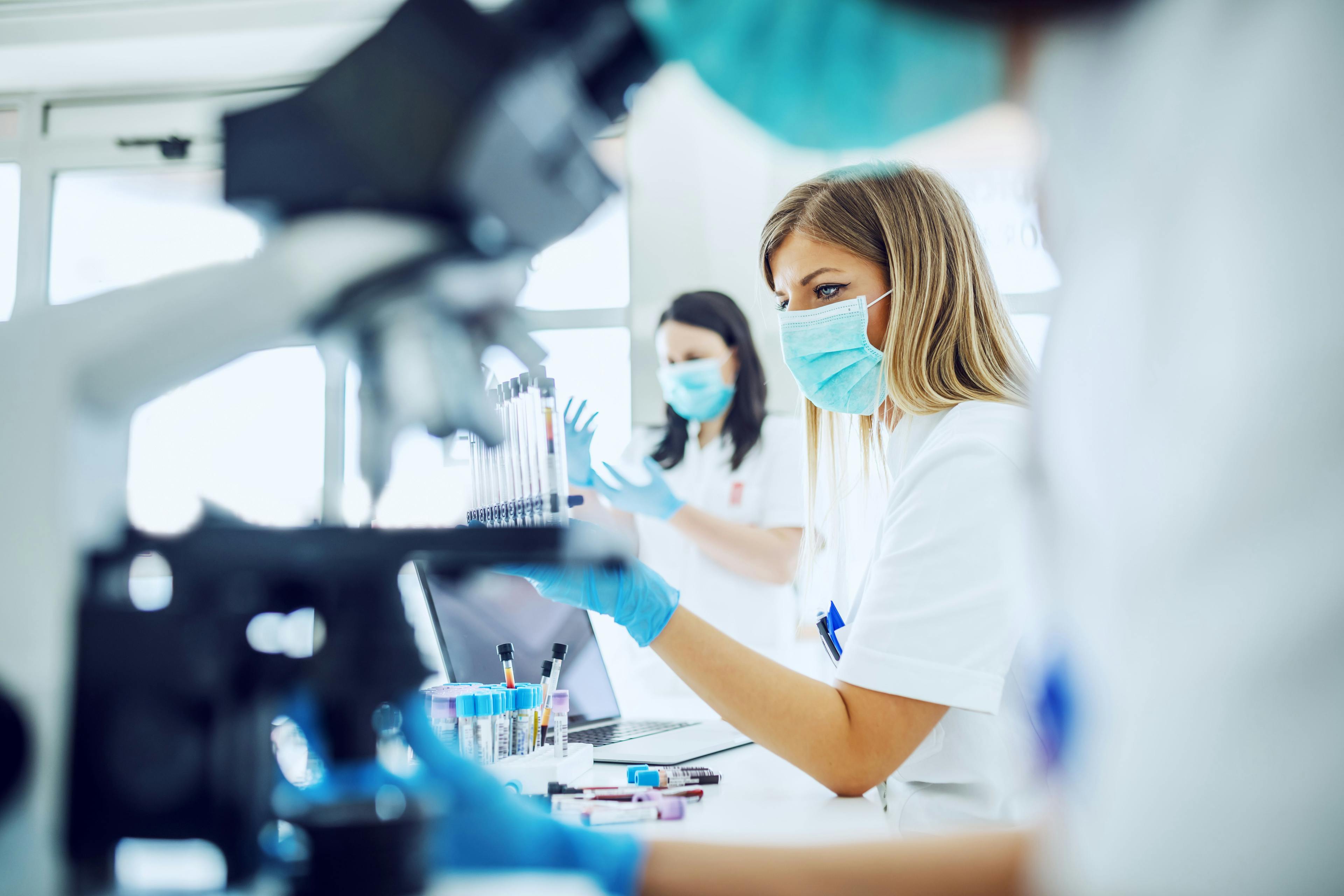 Researchers in a lab -- Image credit: dusanpetkovic1 | stock.adobe.com