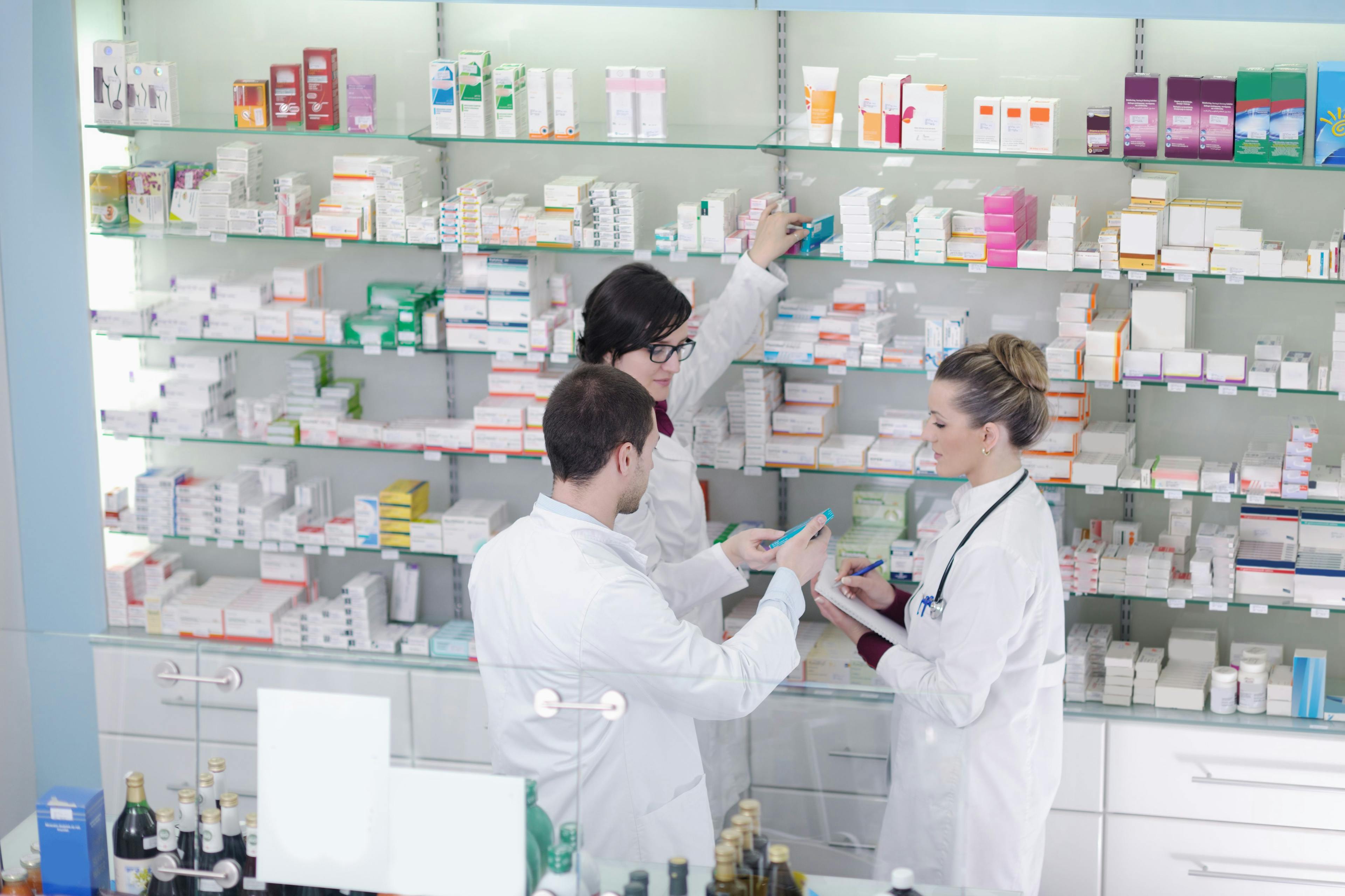 Team of pharmacists collaborating -- Image credit: .shock | stock.adobe.com