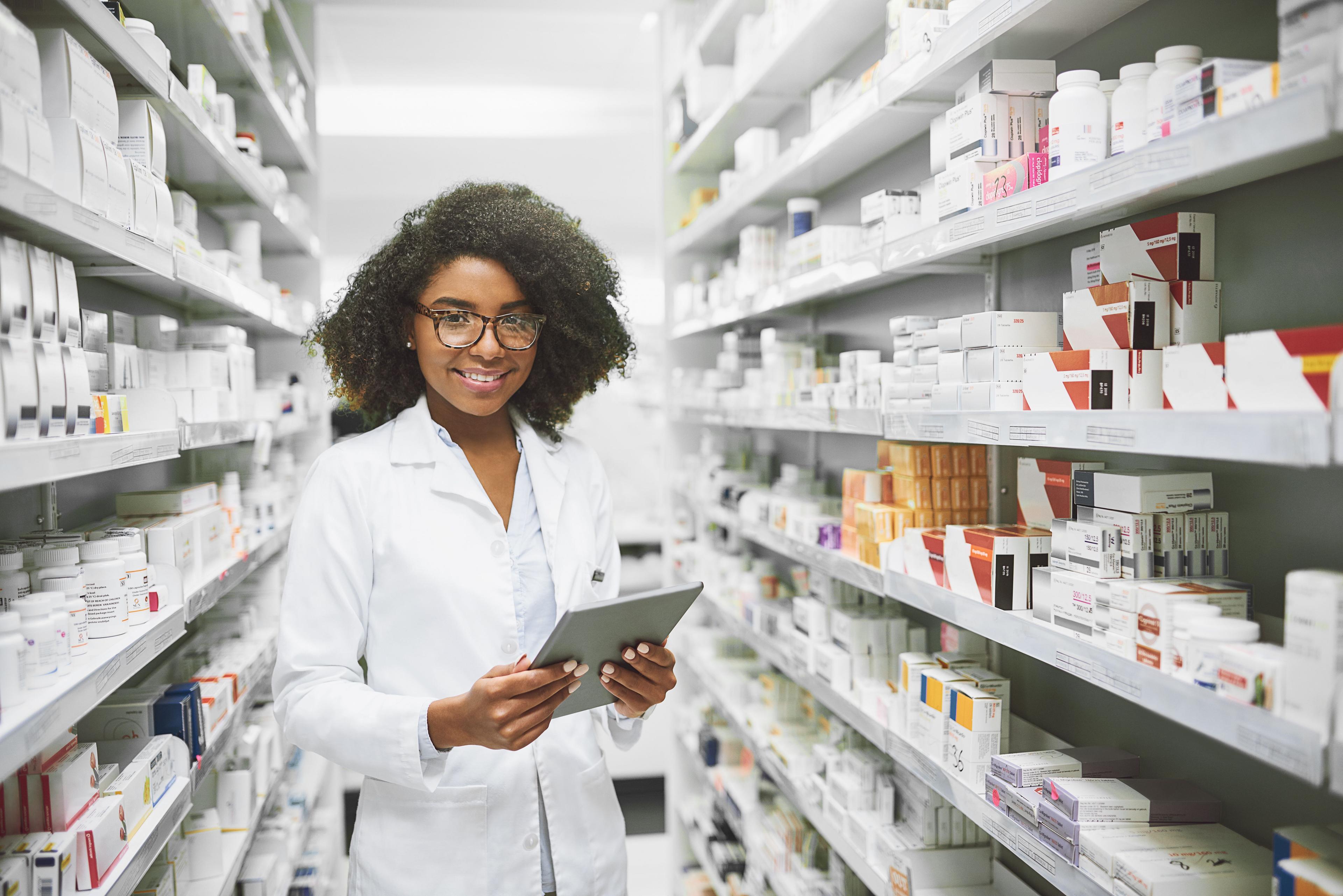 Happy young female pharmacist 