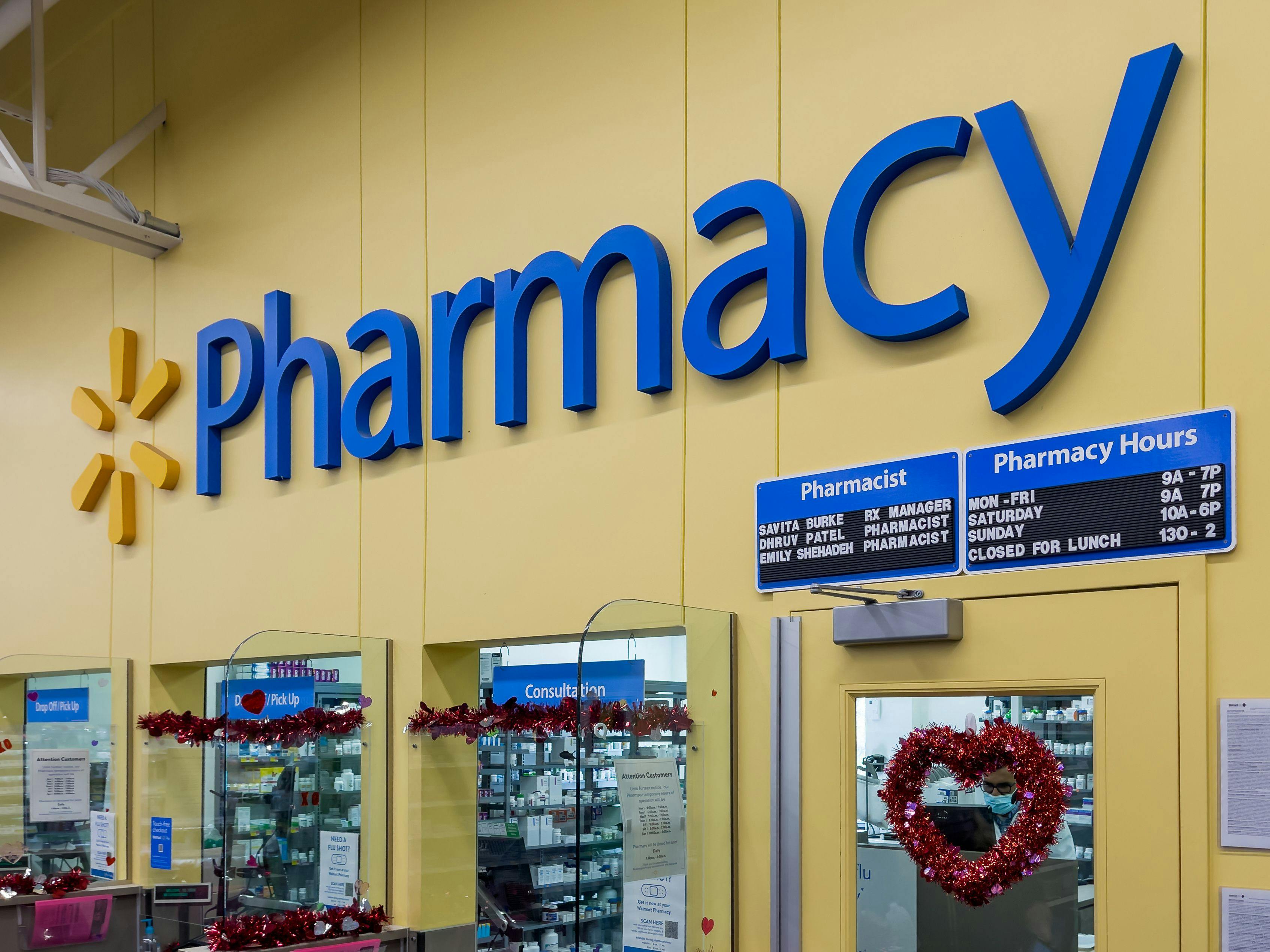 Walmart Pharmacy sign inside Walmart store.