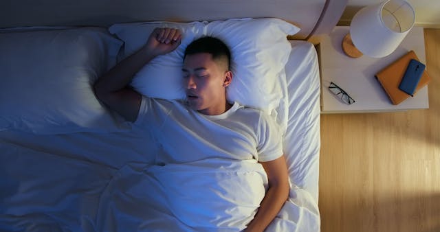 Man with sleep apnea snoring -- Image credit: ryanking999 | stock.adobe.com