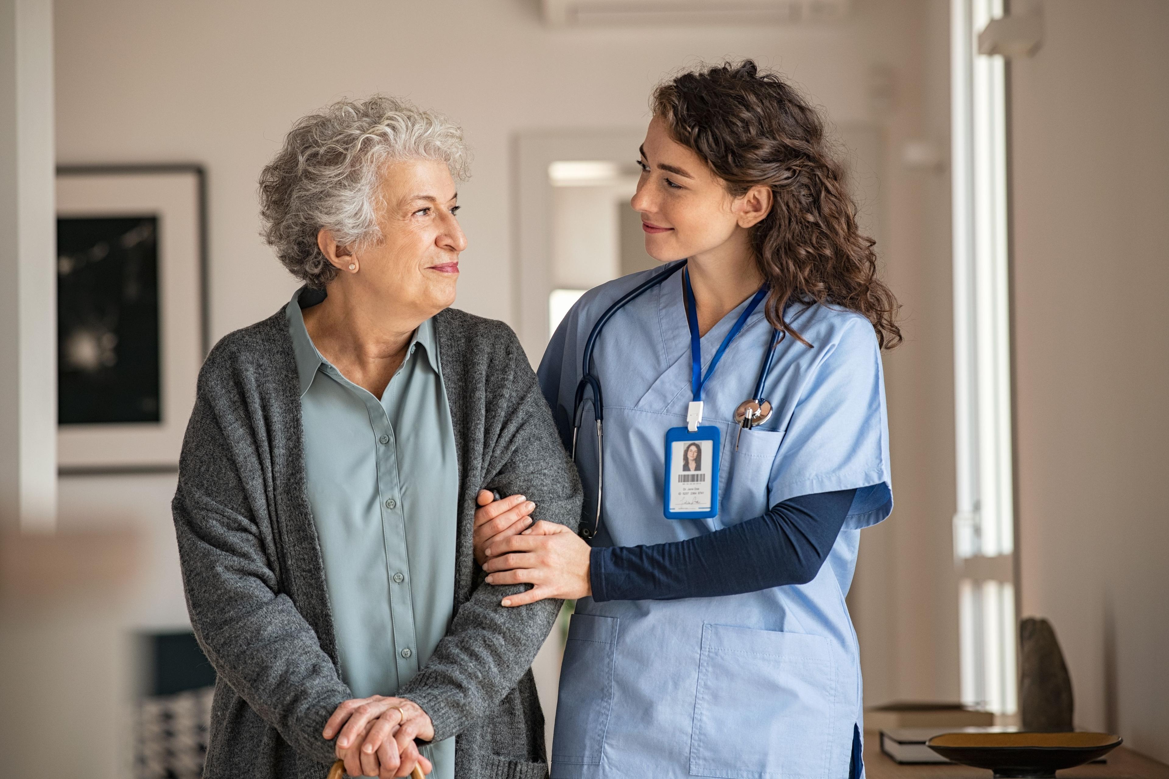 Health care professional and elderly patient -- Image credit: Rido | stock.adobe.com