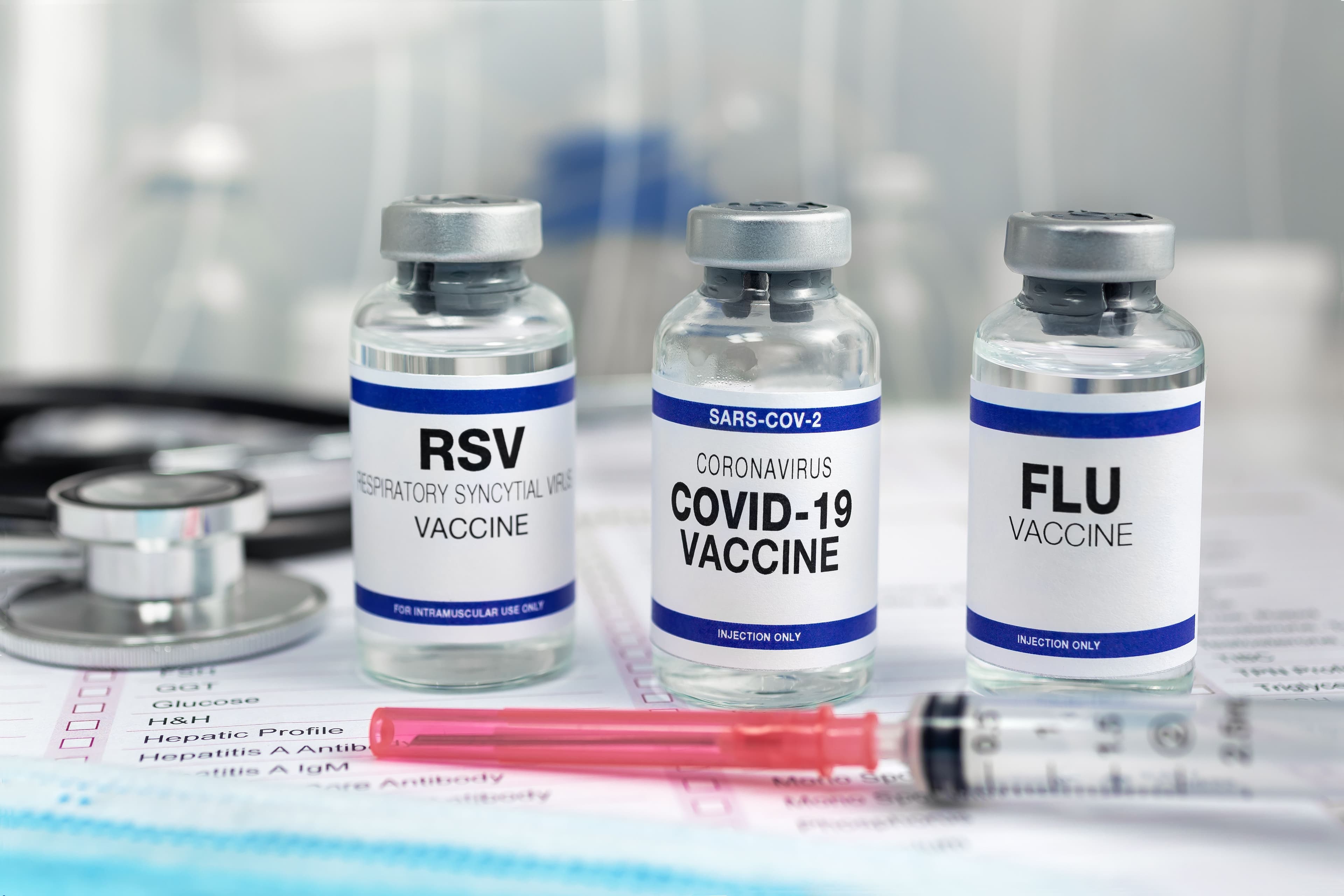 Bottles of vaccine for Influenza Virus, Respiratory Syncytial virus and Covid-19 for vaccination. Flu, RSV and Sars-cov-2 Coronavirus vaccine vials in the medical clinic  - Image credit: angellodeco | stock.adobe.com 