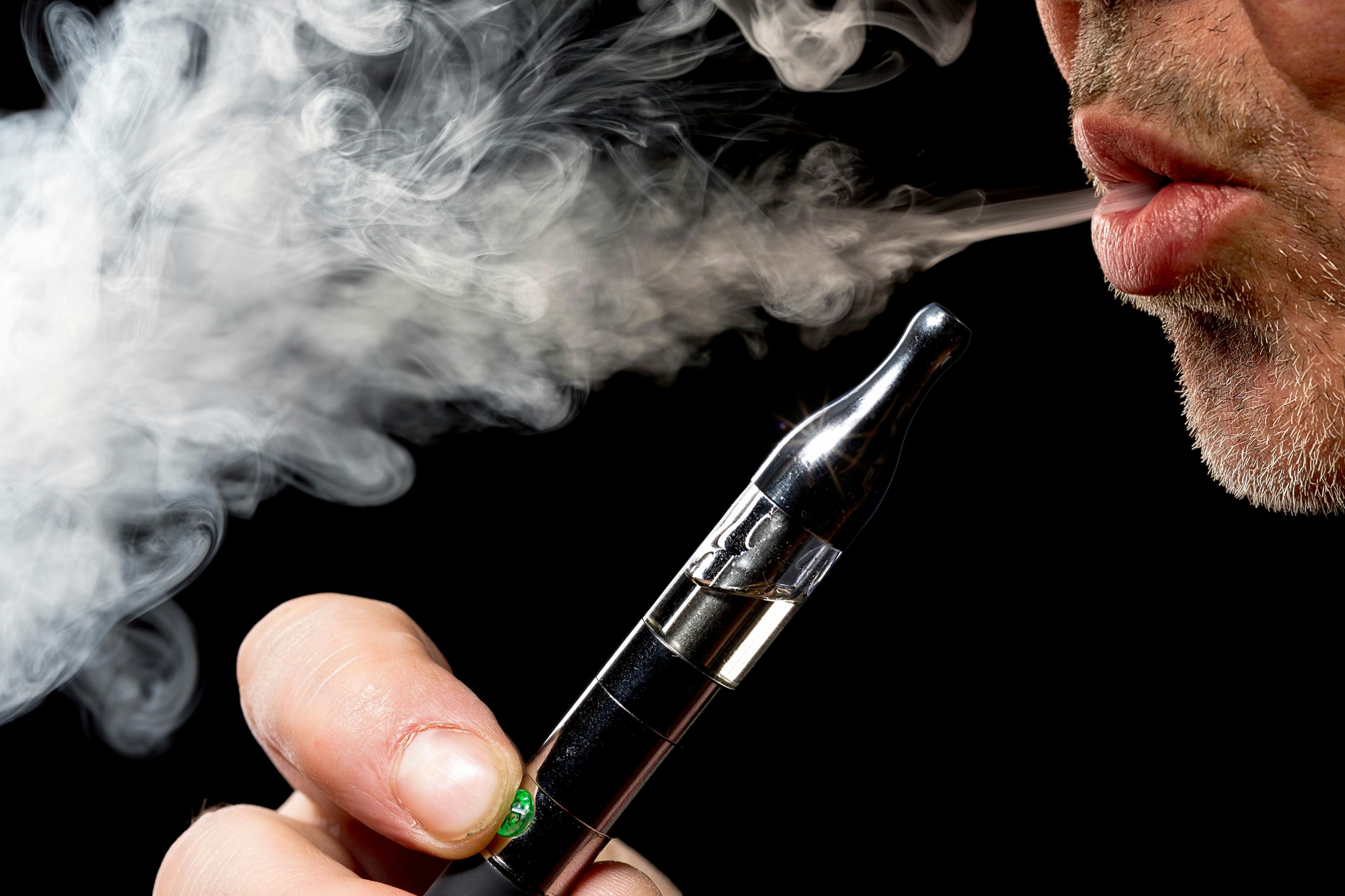 Man using electronic cigarette -- Image credit: Armin Staudt | stock.adobe.com