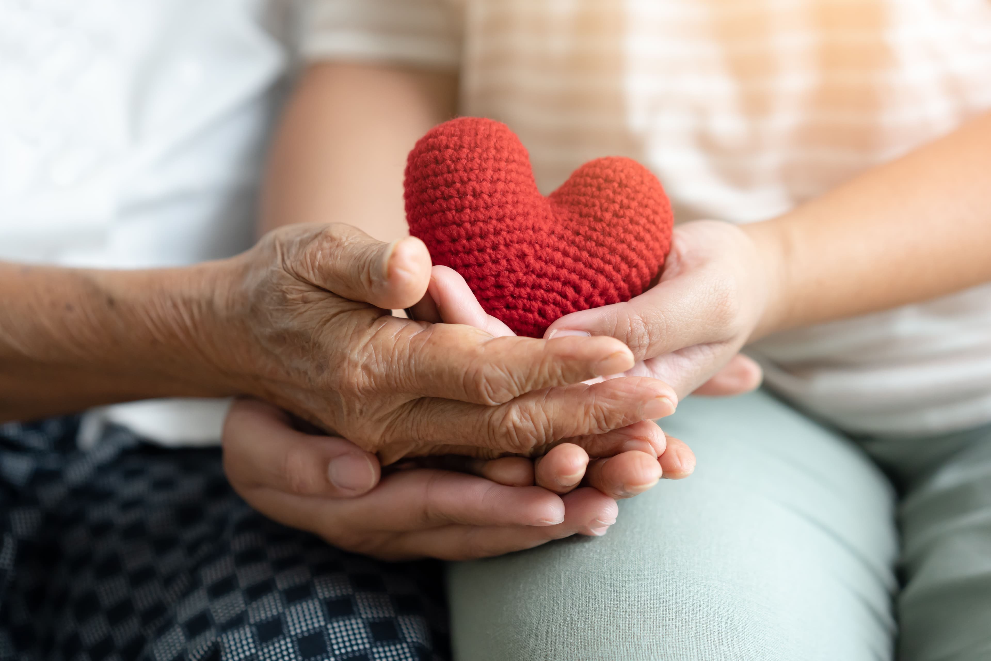 Hands holding a crochet heart | Image Credit: © StockerThings - stock.adobe.com