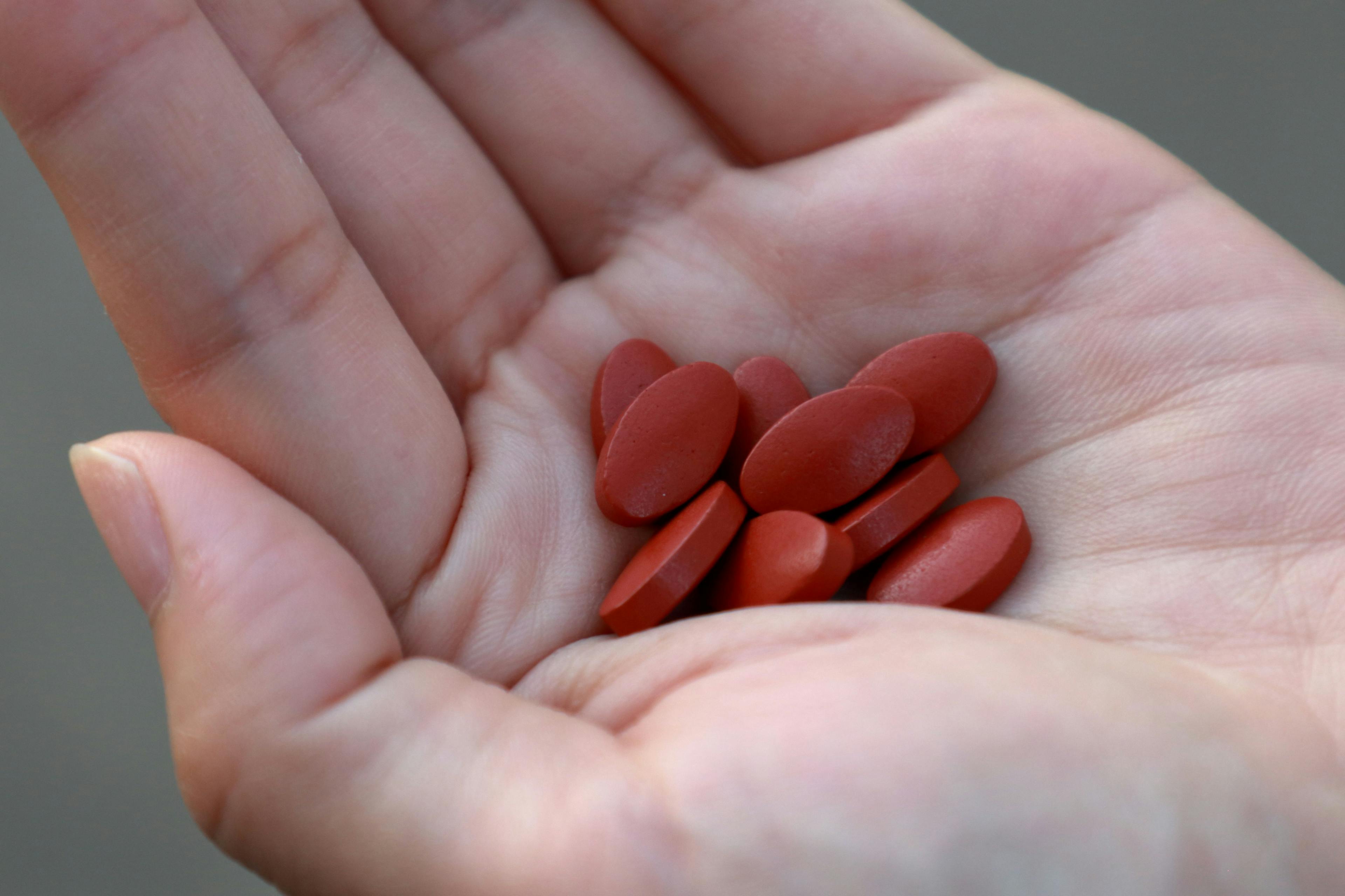 Iron supplement tablets in woman’s hand. for treat iron deficiency anemia - Image credit: agencies | stock.adobe.com 