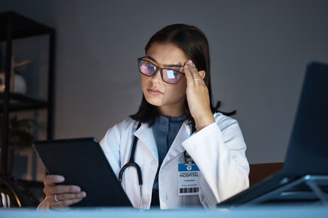 Woman in health care experiencing burnout -- Image credit: Rene L/peopleimages.com | stock.adobe.com