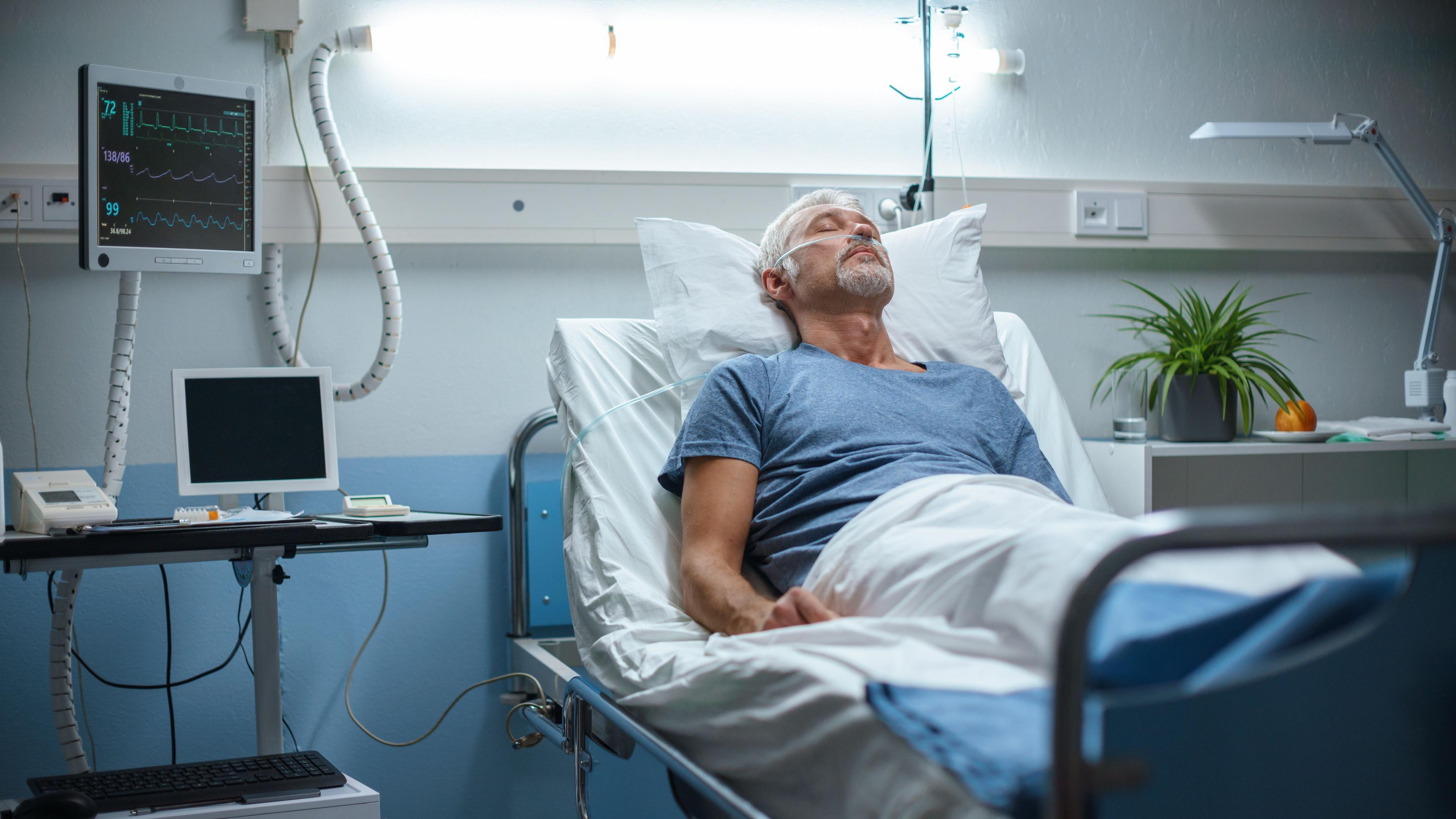 Man in a hospital bed | Image credit: Gorodenkoff | stock.adobe.com