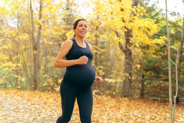 Pregnant woman going for a run -- Image credit: Louis-Photo | stock.adobe.com