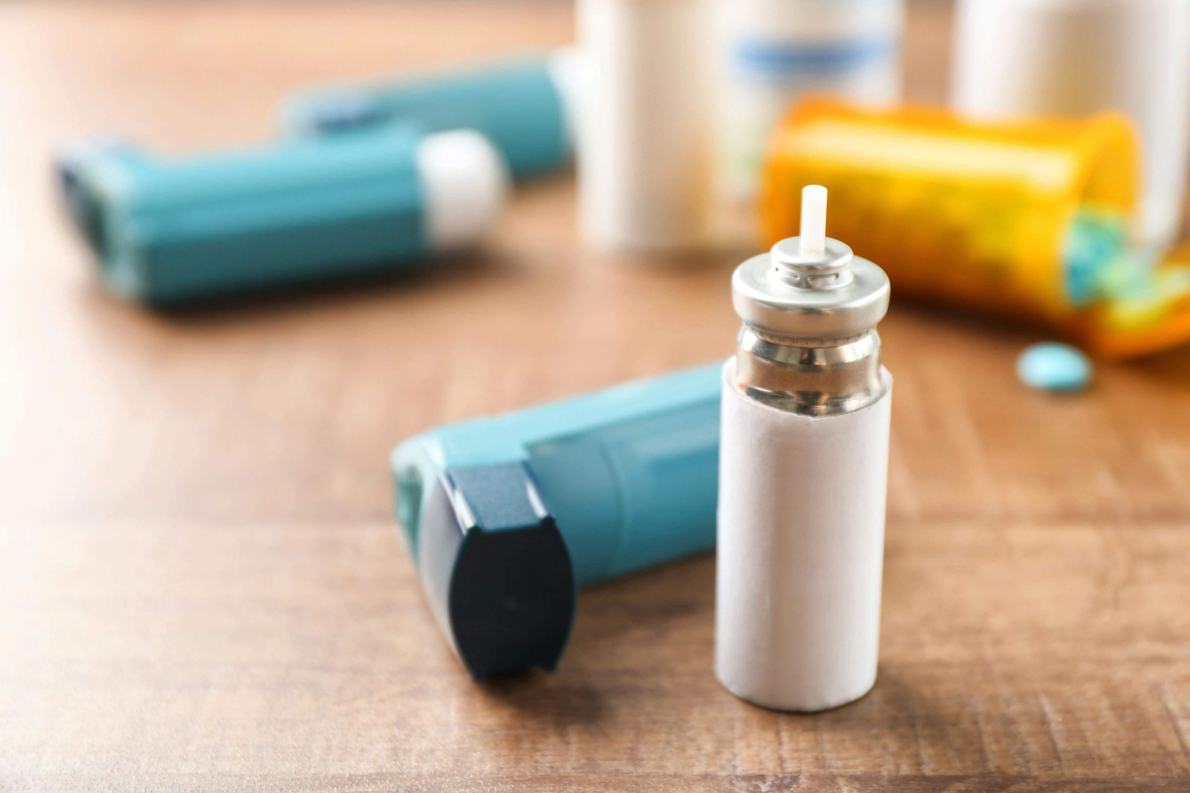 Asthma inhaler with cartridge on wooden table | Image Credit: Africa Studio - stock.adobe.com