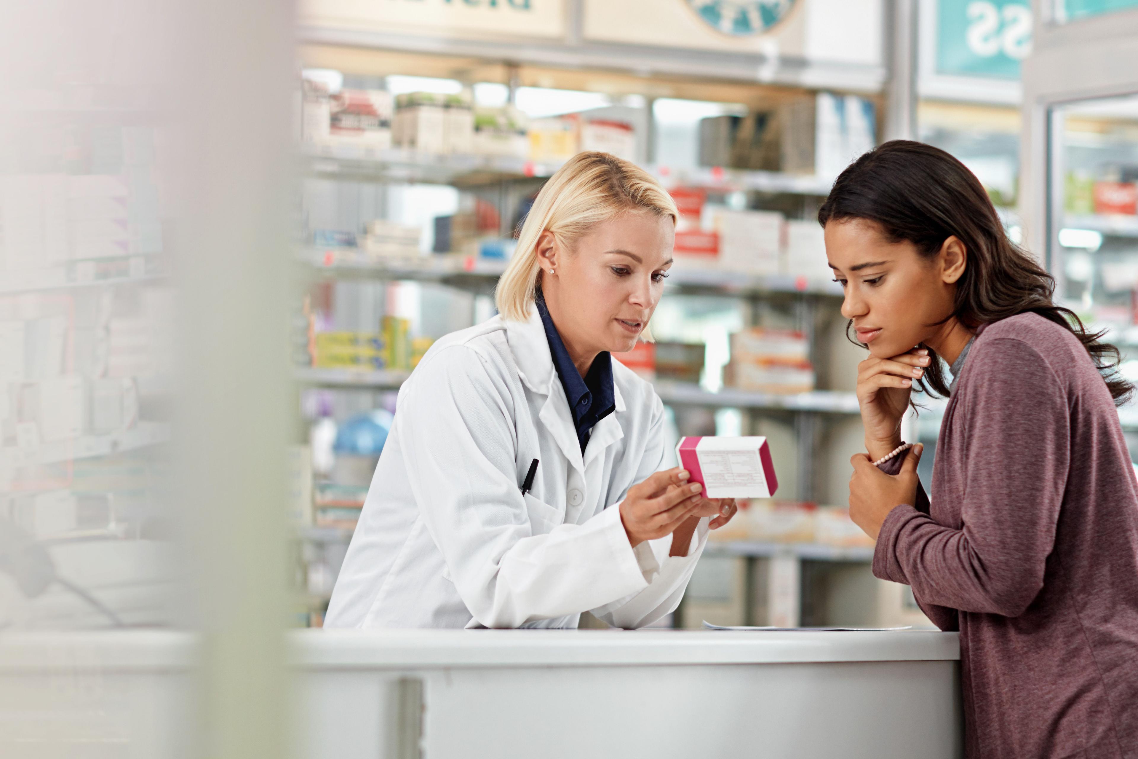 Pharmacist talking with patient -- Image credit: Reese/peopleimages.com | stock.adobe.com