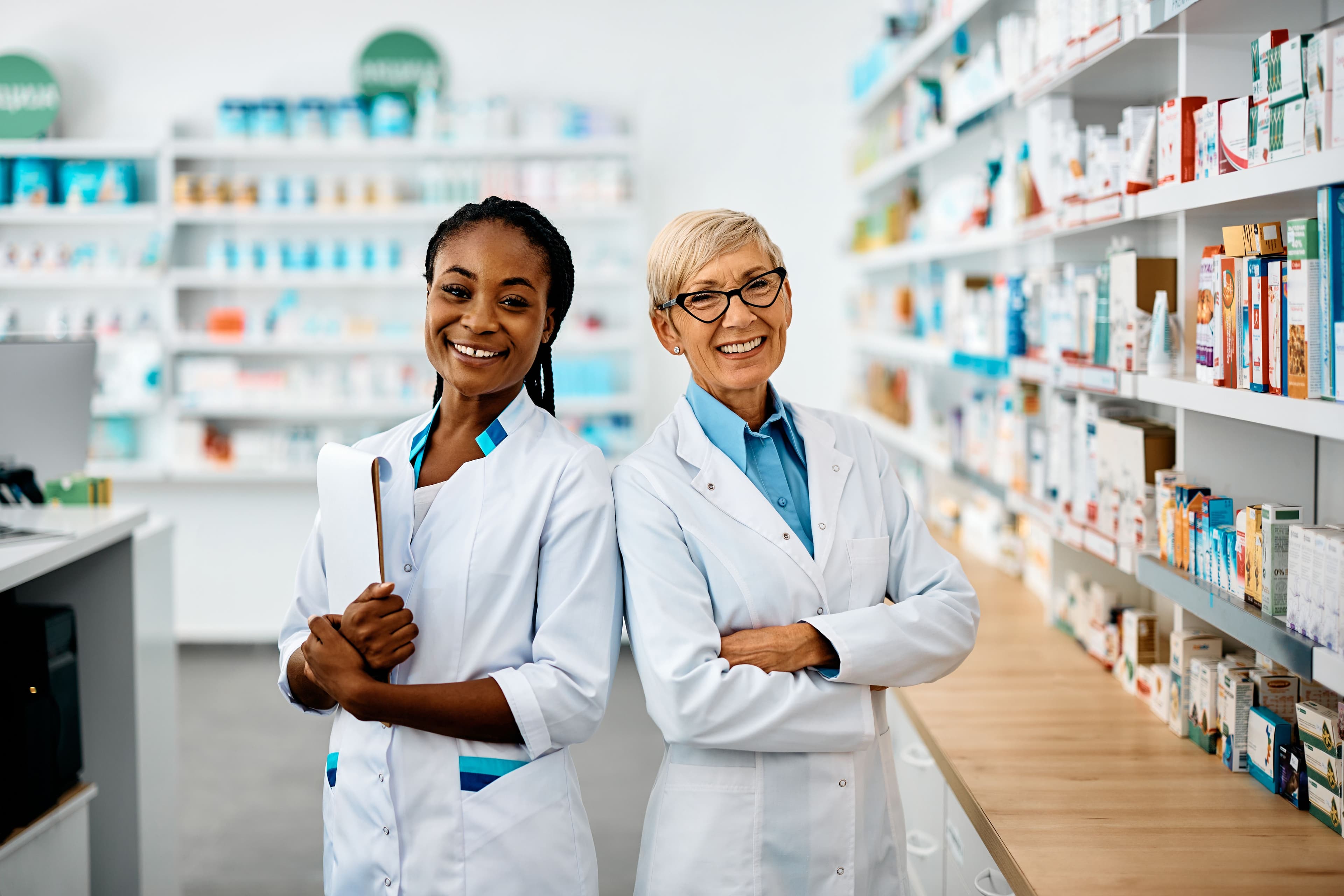 Two smiling pharmacists | Image credit: Drazen | stock.adobe.com