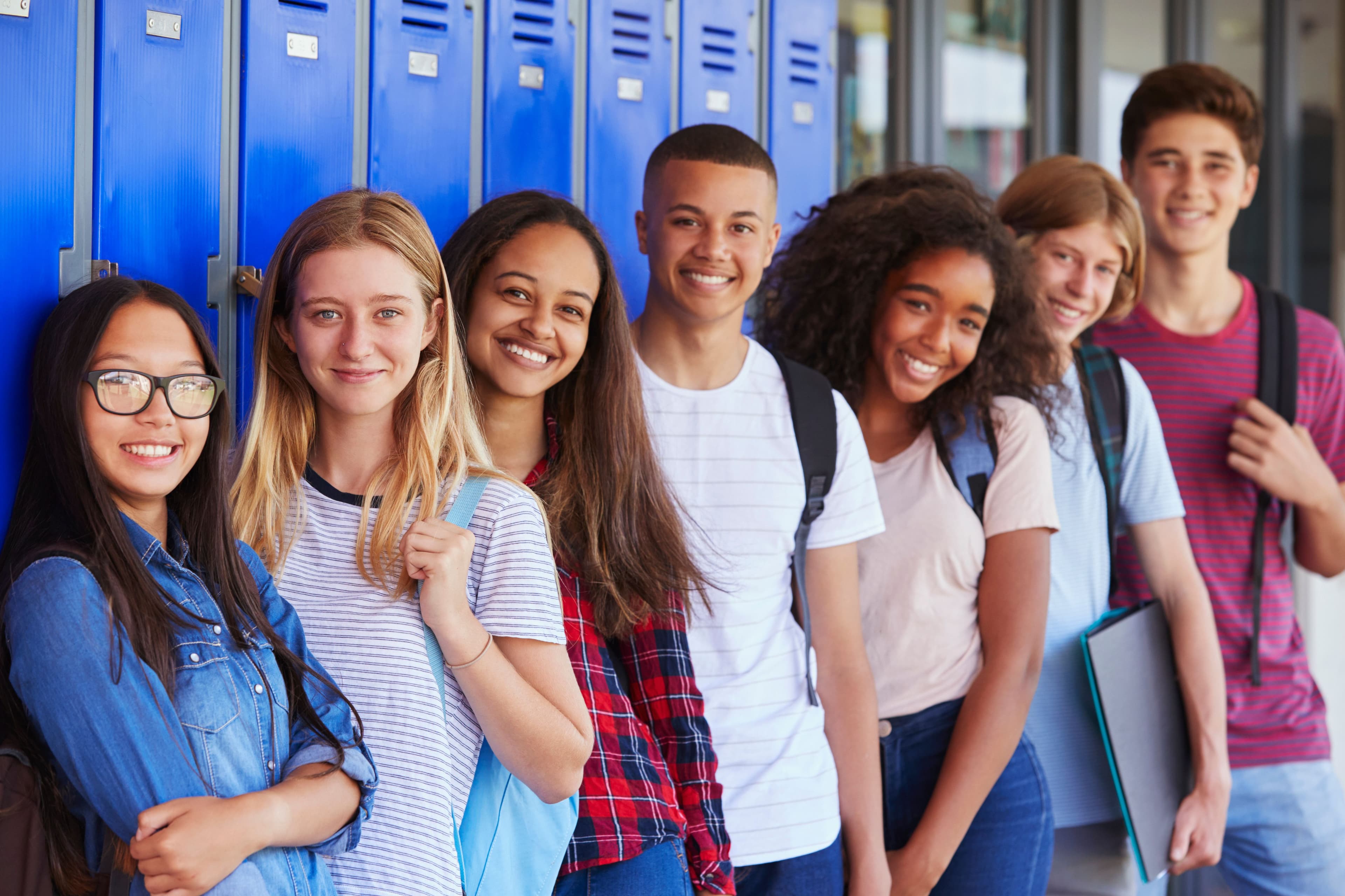 High school students standing by lockers