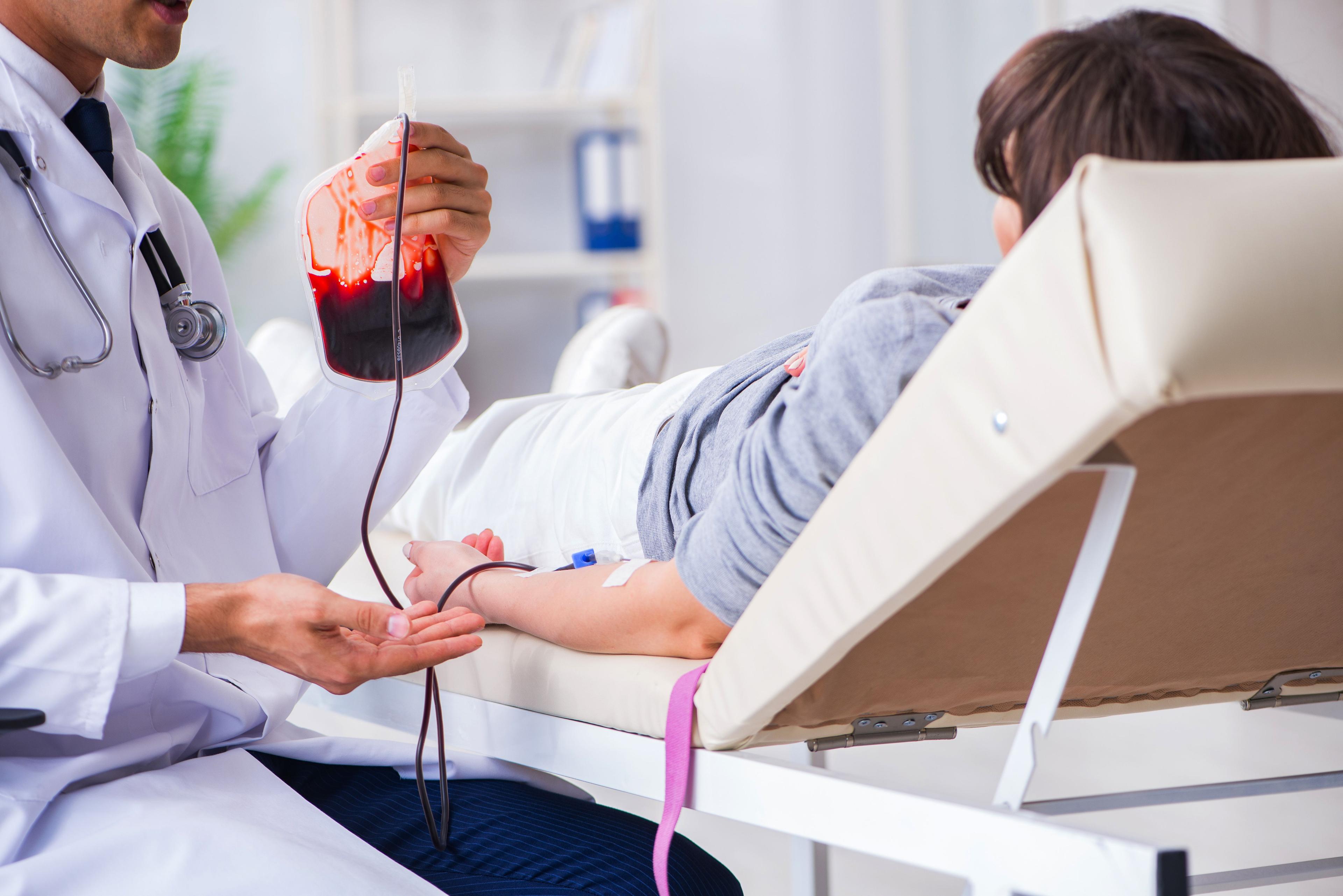 Patient getting blood transfusion in hospital clinic.