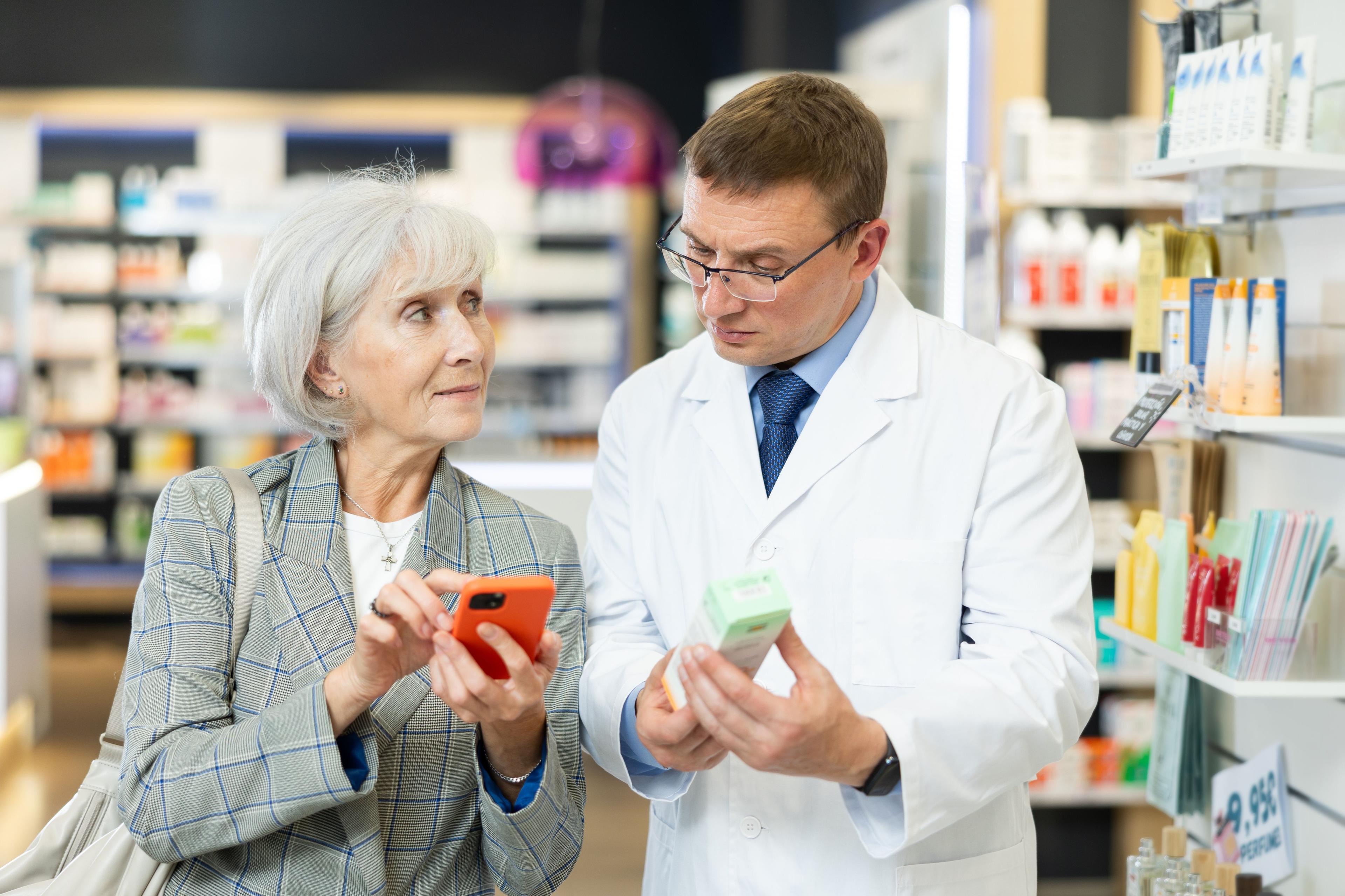 Pharmacist helping a female patient