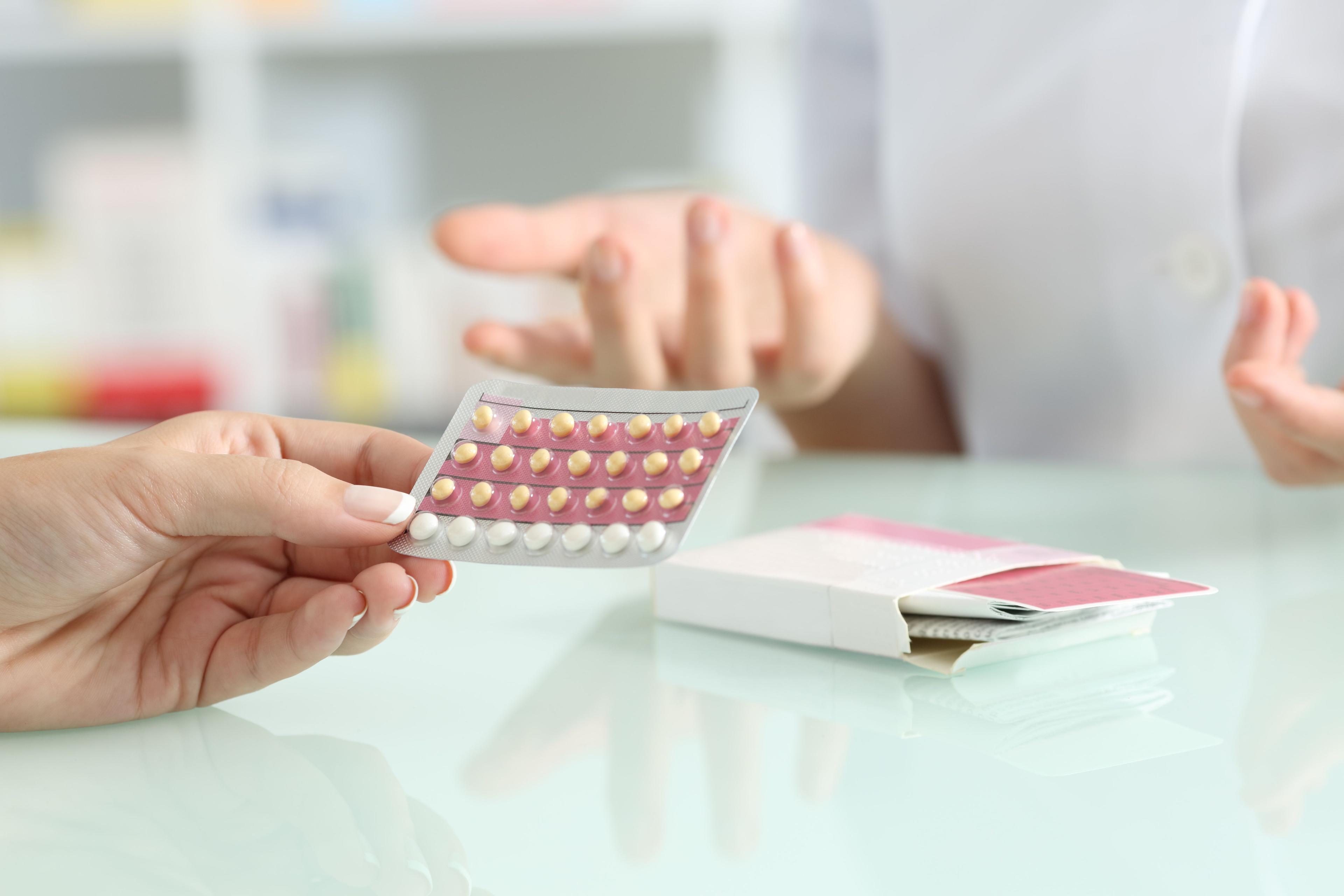 Patient receiving birth control pills from pharmacy -- Image credit: Antonioguillem | stock.adobe.com