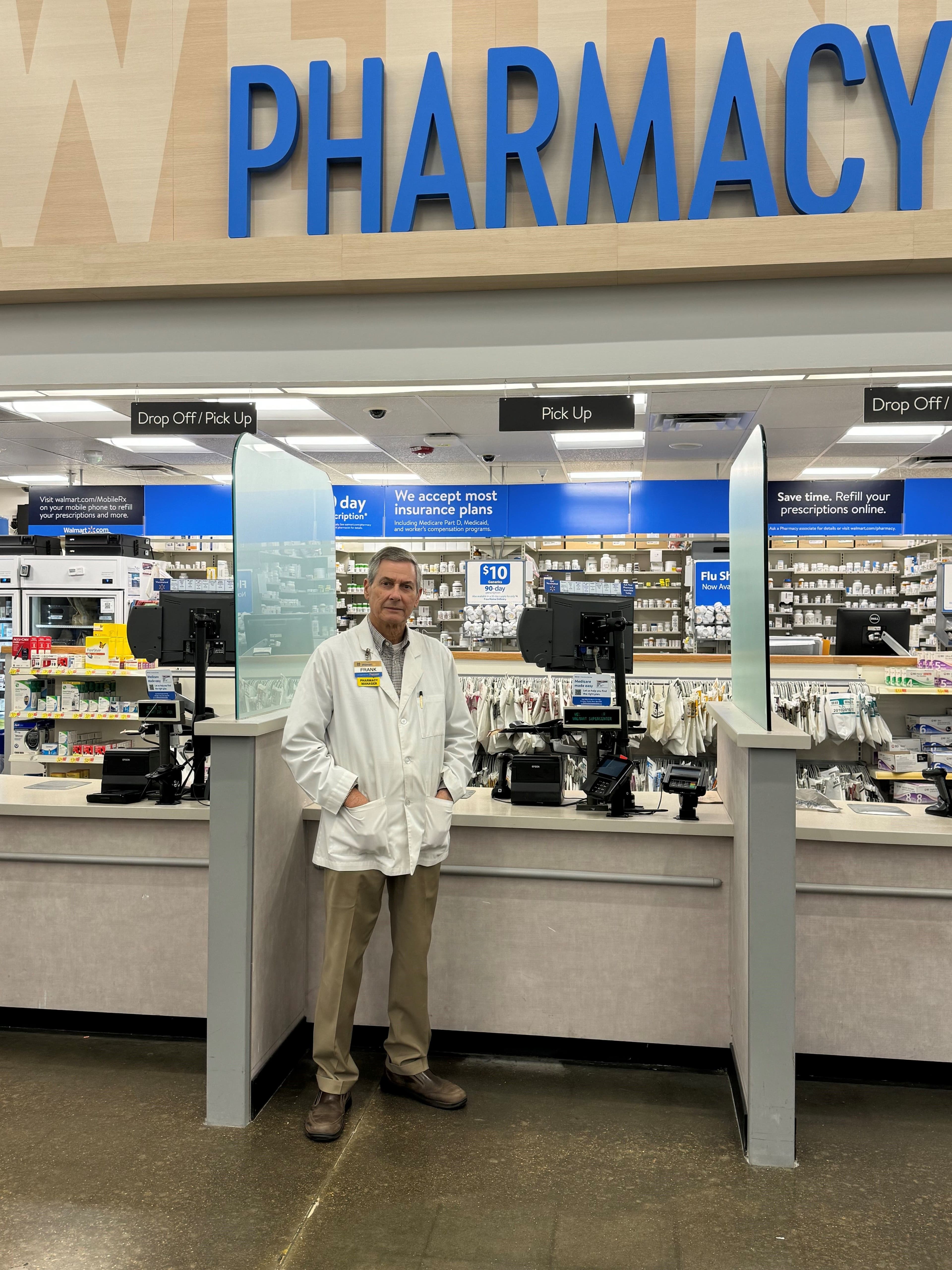 Frank Kessler standing at the counter at his Walmart pharmacy in Memphis, TN. 